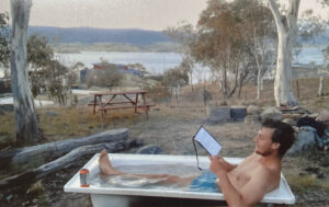 Australian WWOOFer in bathtub. The view is from Noeline’s house
