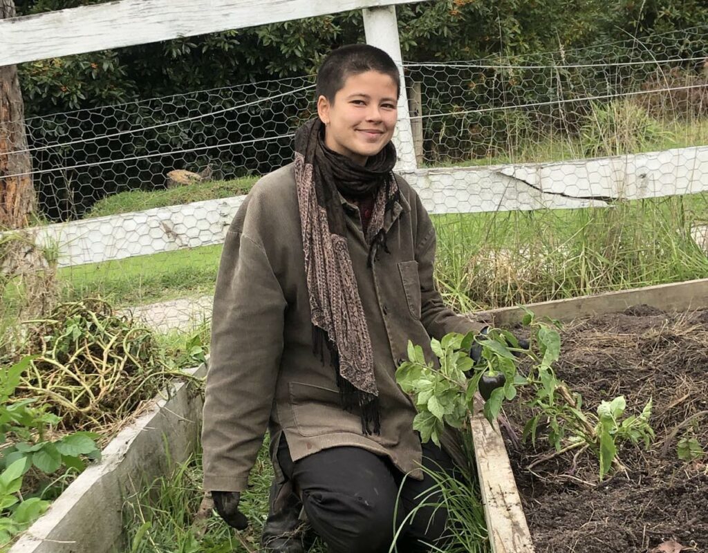 wwoofer working in the vegetable garden