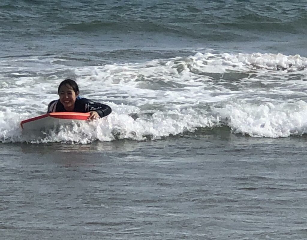 wwoofer body boarding at Inverloch beach.