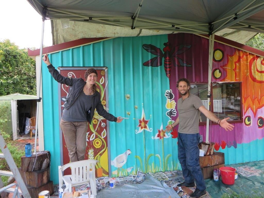 Painting a shed mural at Mia Mia Housing Coop garden